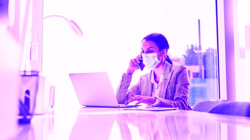 Working on the computer and answering a phone call