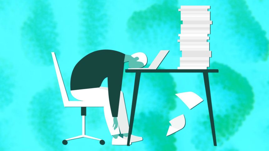Person sitting at desk with stack of papers